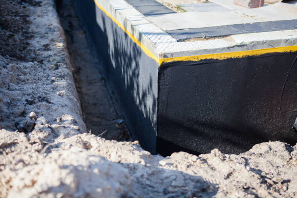 Professional Waterproofing technician working in Robbins, NC